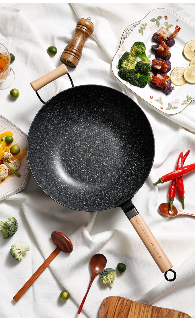 Wok with wheat, rice and stone